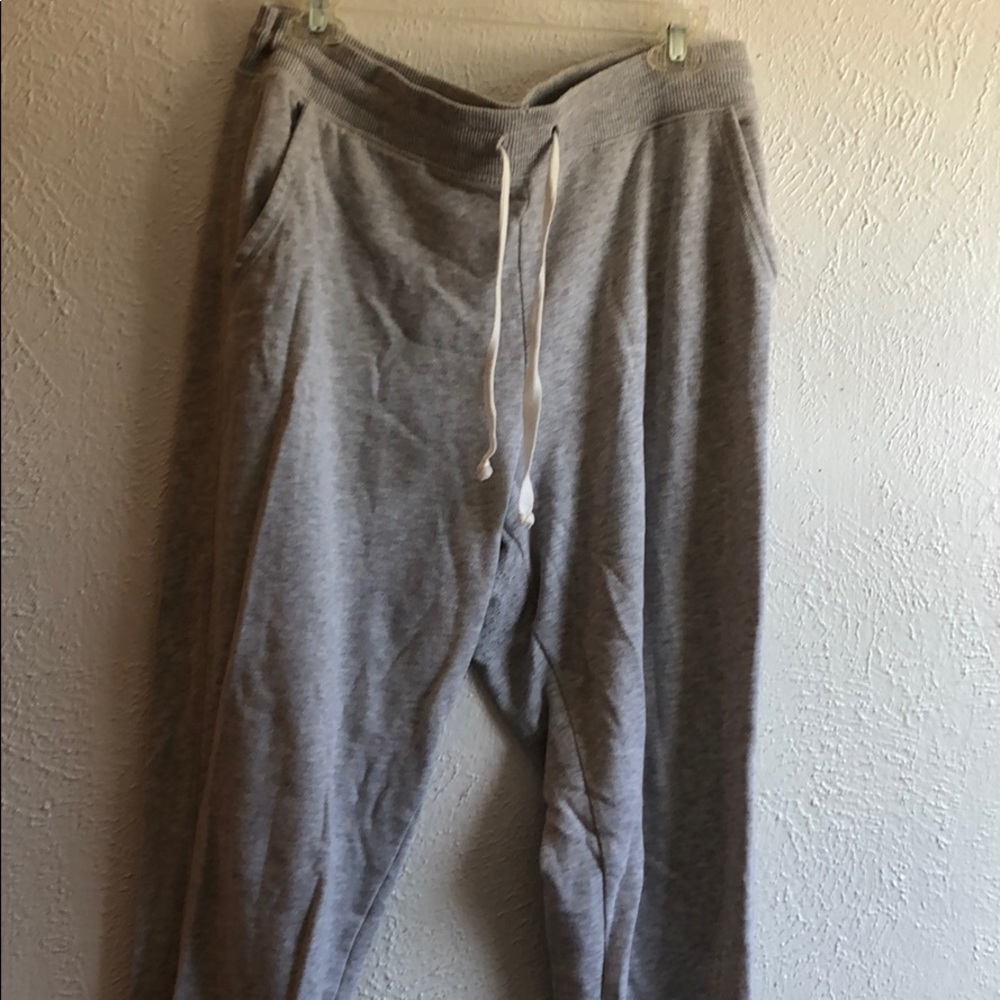 Gray joggers with ankle zippers and pockets